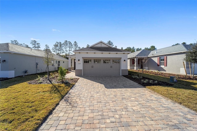 view of front facade featuring a front yard and a garage