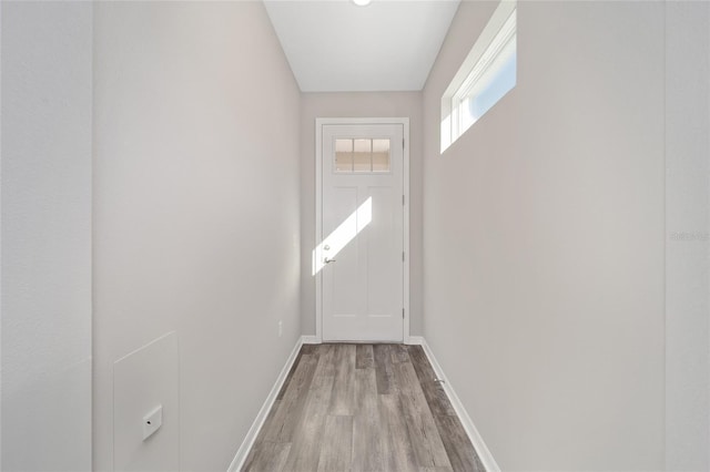 doorway with light wood-type flooring