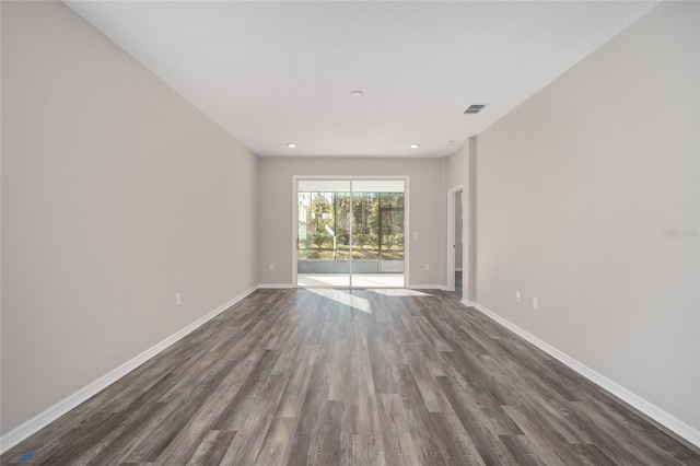 empty room featuring dark wood-type flooring