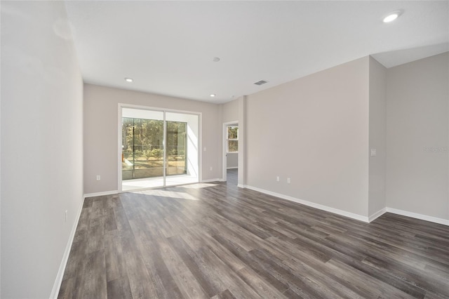 spare room featuring dark hardwood / wood-style floors