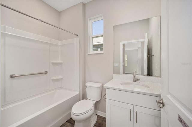 full bathroom featuring toilet, vanity, bathtub / shower combination, and hardwood / wood-style flooring