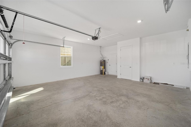 garage with a garage door opener and water heater