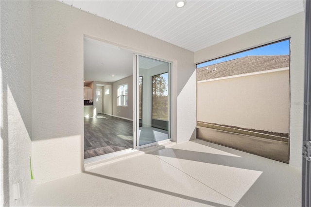 unfurnished sunroom featuring wood ceiling