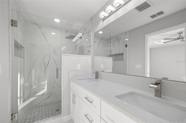 bathroom with vanity, walk in shower, and ceiling fan