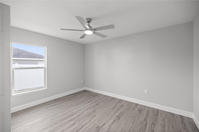 spare room featuring ceiling fan and light wood-type flooring