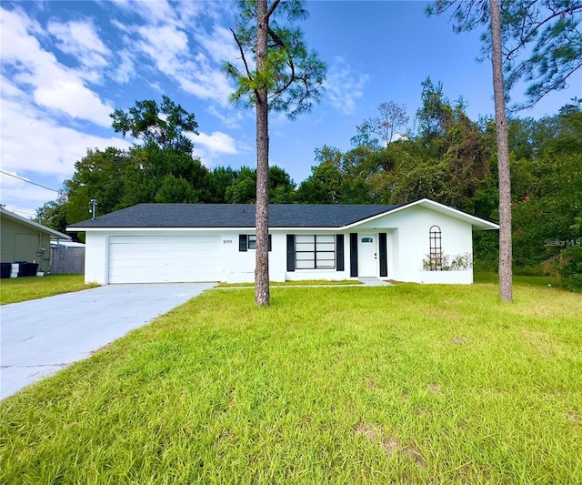 ranch-style house featuring a garage and a front yard