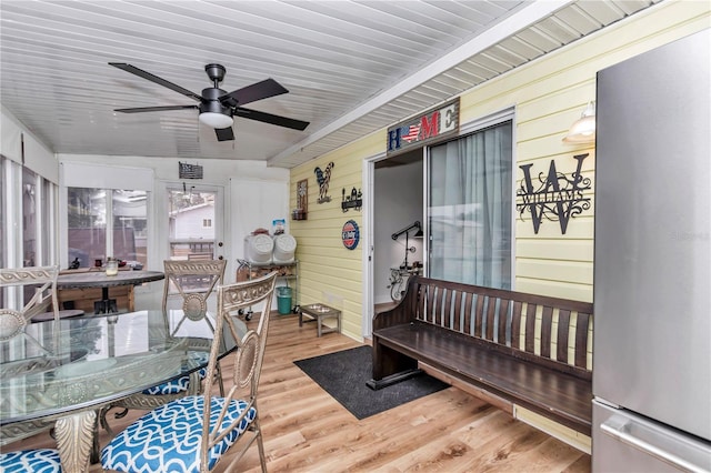 sunroom / solarium featuring ceiling fan