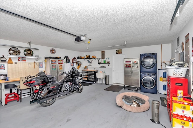 garage with electric water heater, stacked washing maching and dryer, and a garage door opener