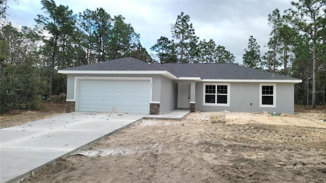 single story home with a garage