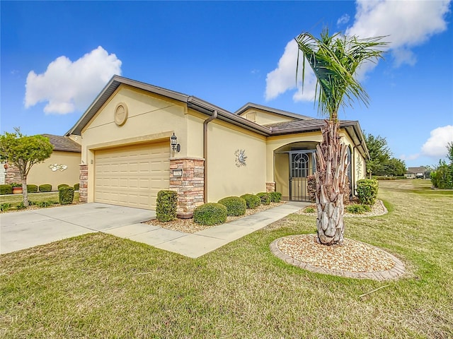 view of front of home with a front lawn and a garage