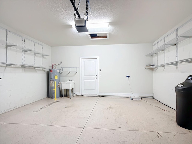 garage with electric water heater, a garage door opener, and sink