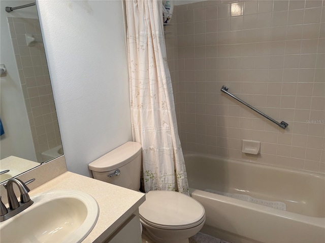 full bathroom with shower / tub combo with curtain, vanity, and toilet