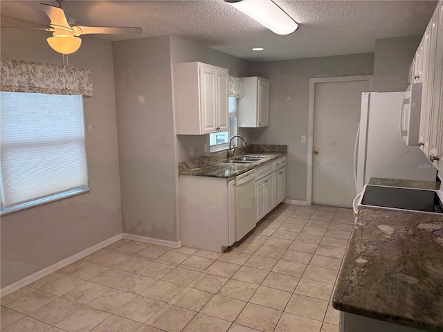 kitchen featuring ceiling fan, sink, light tile patterned floors, white appliances, and white cabinets