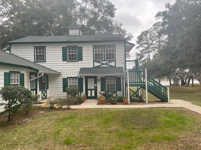 view of property featuring a front yard