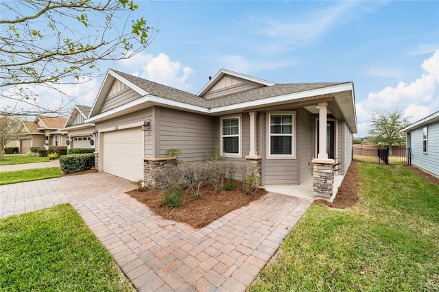 view of front of home featuring a garage and a front yard