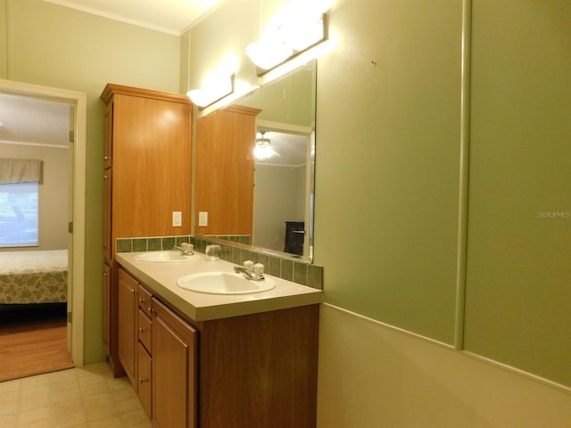 bathroom featuring vanity and ornamental molding