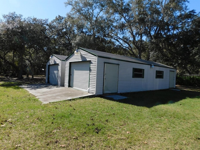 garage with a lawn