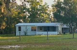 view of outbuilding with a lawn