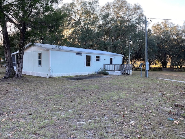 view of front of home with a wooden deck