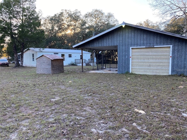 view of outdoor structure featuring a carport and a garage