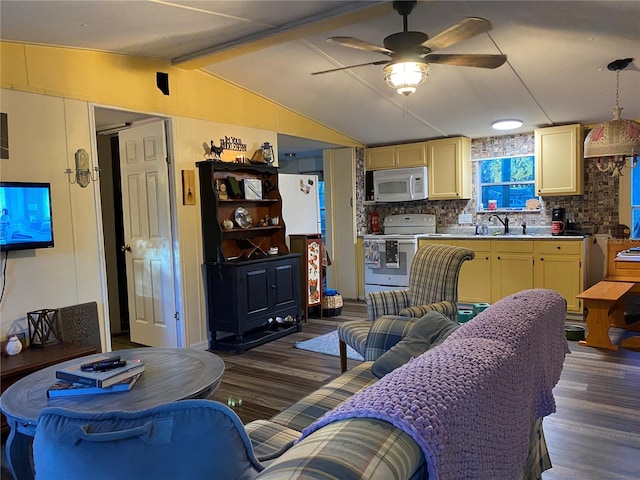 living room with vaulted ceiling with beams, ceiling fan, sink, and dark hardwood / wood-style floors