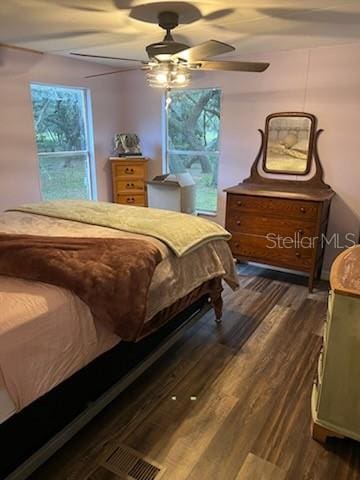 bedroom featuring ceiling fan and dark hardwood / wood-style floors