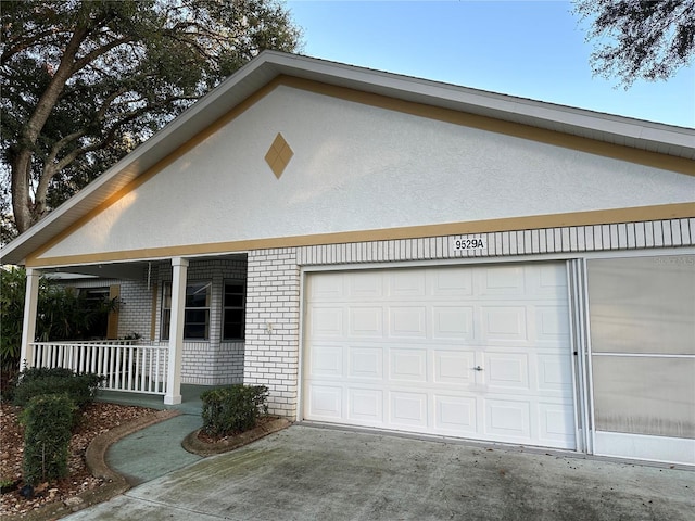 exterior space featuring a porch and a garage