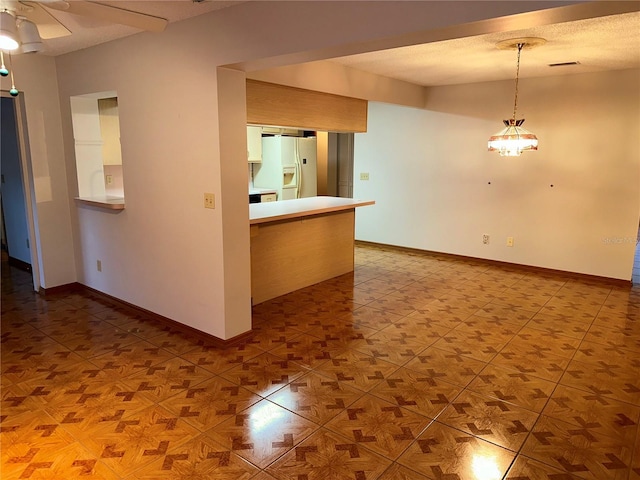 empty room with a textured ceiling and parquet flooring