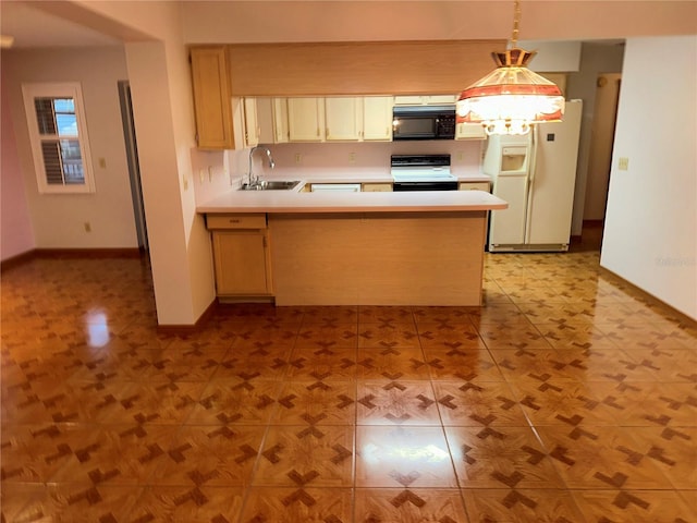 kitchen with kitchen peninsula, stove, sink, pendant lighting, and white fridge with ice dispenser