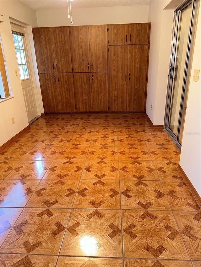 unfurnished bedroom featuring light parquet flooring