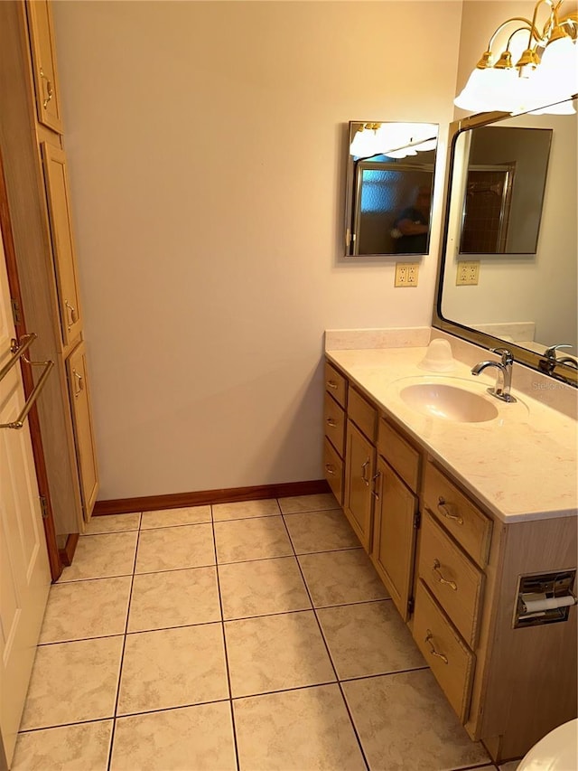 bathroom with tile patterned flooring and vanity