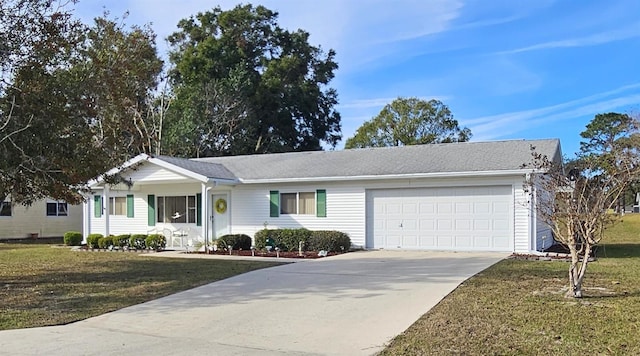 single story home featuring a front lawn and a garage