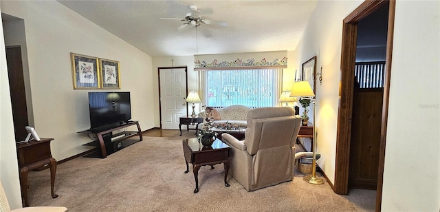 living room featuring carpet floors, vaulted ceiling, and ceiling fan