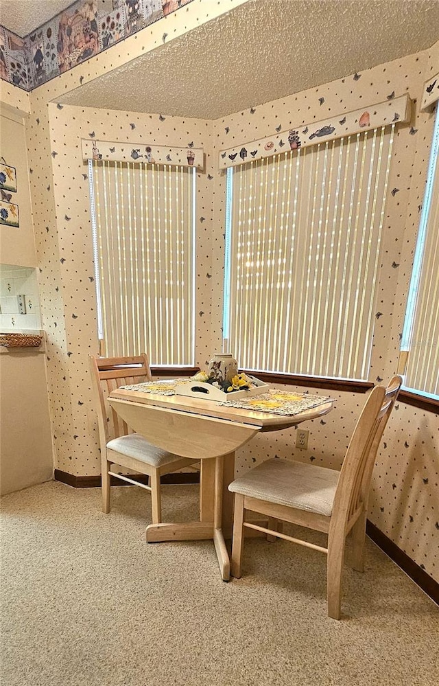 dining area featuring carpet floors