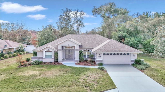 ranch-style house featuring a garage and a front lawn