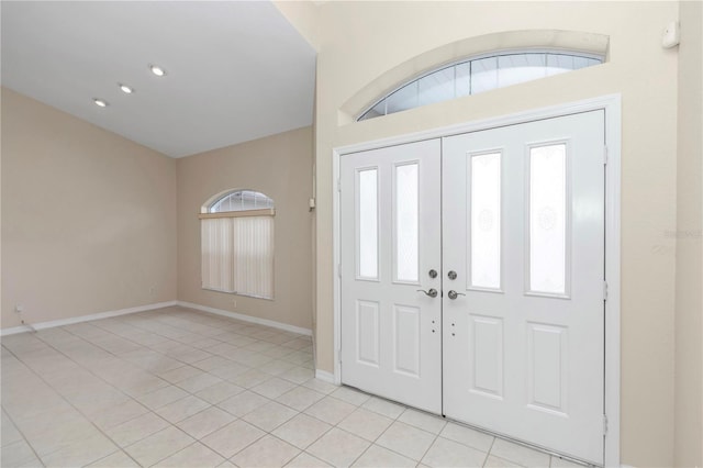 tiled foyer featuring a wealth of natural light