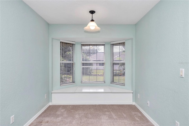 empty room with light colored carpet