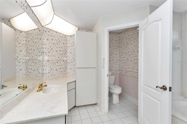 bathroom featuring tile patterned floors, vanity, and toilet