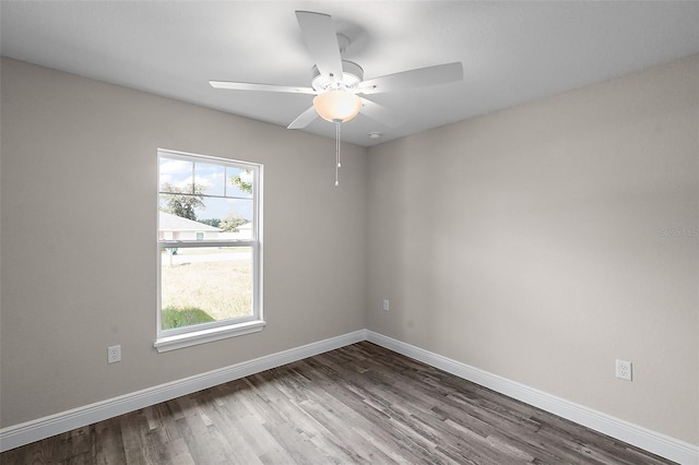 unfurnished room featuring ceiling fan, a healthy amount of sunlight, and wood-type flooring