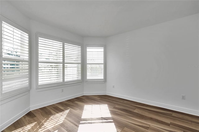 empty room featuring dark hardwood / wood-style floors