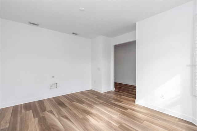 empty room featuring hardwood / wood-style flooring