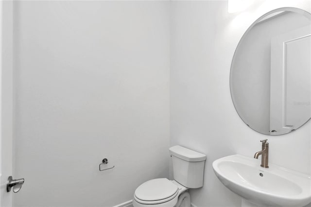 bathroom with toilet and sink