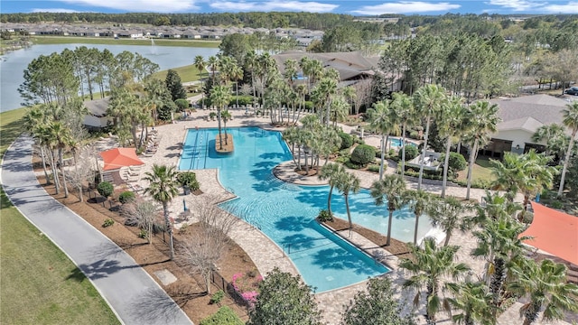 birds eye view of property with a water view