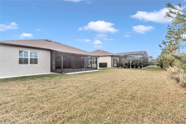 back of property featuring a lawn and a lanai