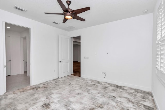 unfurnished bedroom featuring ceiling fan