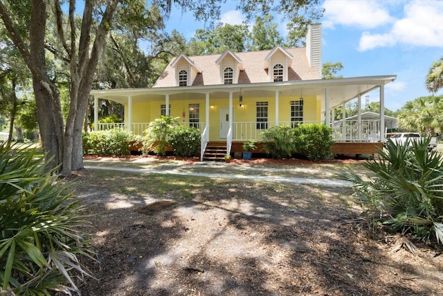 country-style home featuring covered porch