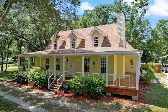 farmhouse inspired home with a porch