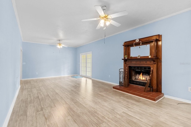 unfurnished living room with a fireplace, light hardwood / wood-style floors, and crown molding