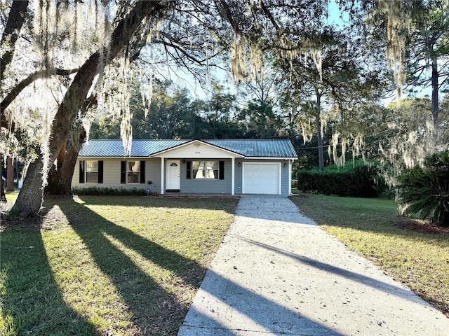 ranch-style home with a front yard and a garage