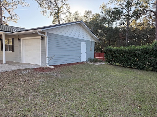 garage with a lawn